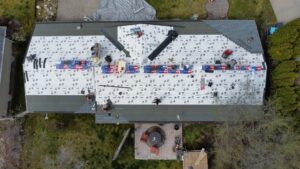 drone aerial footage of a roof replacement in process by Western Montana Roofing