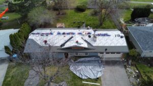 drone aerial footage of a roof replacement in process by Western Montana Roofing